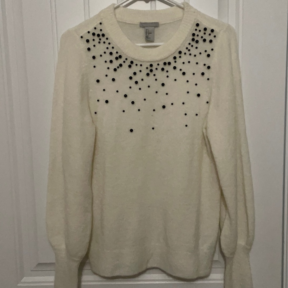 H&M lightweight off white sweater with black beaded top. Slight puff shoulders.